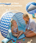 Pop Up Baby Beach Tent With UPF 50+ Canopy, portable sun shade for infants and toddlers on beach with woman and child inside