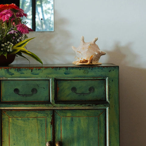 Oil rubbed bronze pull on a green cabinet with flowers and a shell, showcasing Slick And Dang Durable Drop Bail Cabinet Pulls With Oil Rubbed Bronze Finish Quick Setup Vibes For Kitchen Drawers Or Furniture Knobs 4 Inch Center To Center Knockout Look Upgrade Super Smooth Handle.