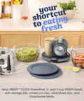 Five In One Food Prep And Storage Bowl System With Crinkle Slicing Shredding Functions on kitchen countertop, featuring bowls and tools.
