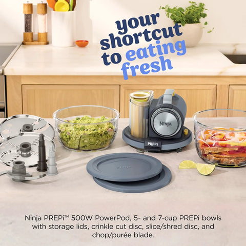 Five In One Food Prep And Storage Bowl System With Crinkle Slicing Shredding Functions on kitchen countertop, featuring bowls and tools.
