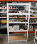 Badass Five Tier Laminated White Metal Shelving Unit For Tight Garages And Basements Holds Everything You Own No Mess Just Clean Storage That Stays Fully Adjustable For Your Warehouse And Pantry Needs, organized with tools and materials.
