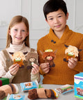 Kids holding Highland Cow keychains made with Awesome Three Pack Needle Felting Kit For Beginners With Wool Felt Tools.