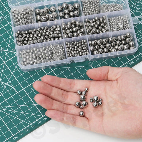Premium Assorted Stainless Steel Ball Bearings Kit Featuring Three Hundred Pieces in Twelve Precise Sizes For Hassle Free Bicycle Repairs Ultra Smooth Caster Wheels And Quick Garage Fixes, assorted sizes in hand.