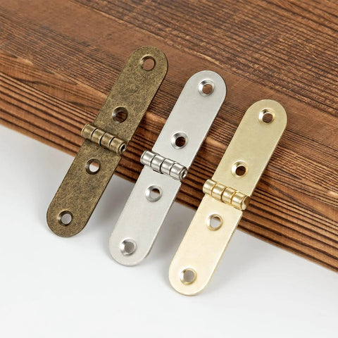 Forty Piece Gold Brass Mini Hinges With Matching Screws Offering No Sweat Installation And Fade Proof Finish Perfect For Tiny Drawers Birdhouses And All Your Weekend Warrior Maker Projects displayed in three colors on wood surface.