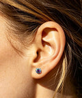 Premium 5A Cubic Zirconia Screw Back Stud Earrings For Men And Women, showcased on a model's ear, highlighting the design.
