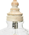 Close-up of clear glass shade pendant light with distressed cream mango wood canopy, rustic yet modern ceiling fixture.