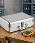 Premium Aluminum Alloy Tool Box with Foam Interior and Sturdy Handle for Safe Transit and Organized Storage of Tools or Valuable Items Travel Friendly Hard Shell Container that Keeps Your Gear Lock Tight on a wooden workbench.