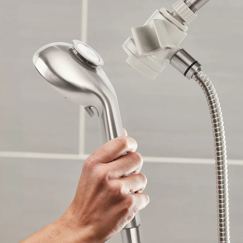 Hand holding Magnetic Adjustable Height Handheld Shower Head With Dual Dock 5 Foot Metal Hose PowerPulse Massage Brushed Nickel Finish