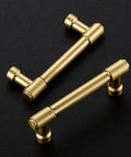 Pro Grade Brushed Gold Cabinet Handles And Sleek Modern Pulls With A Straightforward Three Inch Hole Center Spacing Heavy Duty Zinc Frame For No Fuss Installation And Sharp Home Refresh Smooth Glide Two Pack, with two brushed gold pulls on black background.