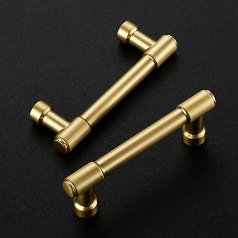 Pro Grade Brushed Gold Cabinet Handles And Sleek Modern Pulls With A Straightforward Three Inch Hole Center Spacing Heavy Duty Zinc Frame For No Fuss Installation And Sharp Home Refresh Smooth Glide Two Pack, with two brushed gold pulls on black background.
