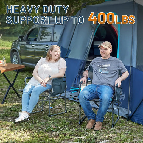 Two people seated on Aluminum Camping Directors Chair With Side Table Pocket Portable Folding Lawn Chair For Fishing Trips Picnics Concerts And Other Outdoorsy Fun Heavy Duty 400 Lbs Capacity Navy near a tent