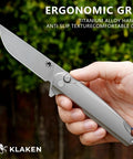 Hardcore Folding Pocket Knife With Tight Grip Textured Titanium Handle And Razor Sharp 14C28N Stainless Steel Blade in hand, ergonomic design.