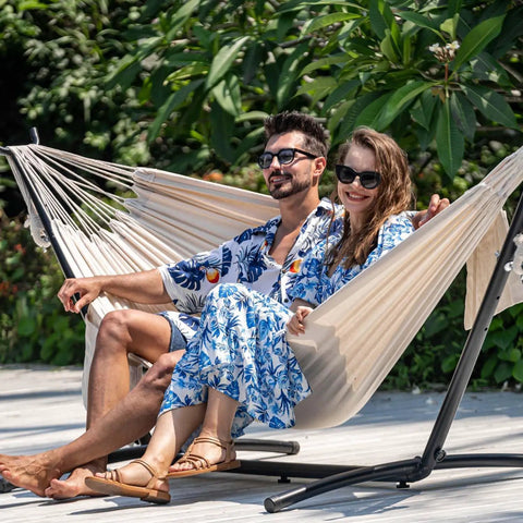 Couple relaxing on Double Hammock With 9 Ft Space Saving Steel Stand Includes Carrying Case Weather Resistant Cotton Super Cozy
