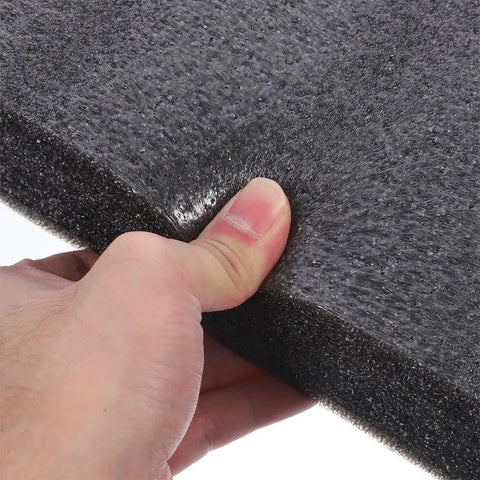 Person holding a Two Piece Black Polyethylene Foam Pad, showcasing its texture and cushioning for shock resistant tool storage.
