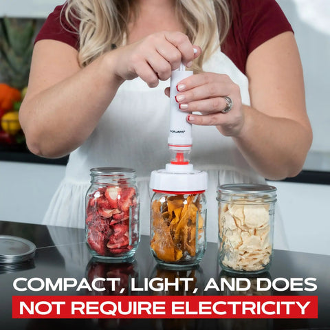 Person using Mason Jar Vacuum Sealer Accessory Set with Cordless Hand Pump on dried fruits in mason jars