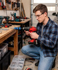 Man using red Rivet Adapter Drill Kit For Quick Auto Body Repairs, Cordless Riveting System With Durable Metal Head in garage