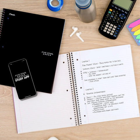Hustle Ready Black Spiral Notebook With Five Subject Sections And College Ruled Paper Providing Clean Lines And No Bleed Pages Built For Daily Study Grinds And Phone Pairing on a desk with a smartphone and calculator.