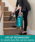 Person using Intuition Lift Up Bagged Upright Vacuum With Two Motor Power Suction And HEPA Filter No Touch Bag Tech on stairs