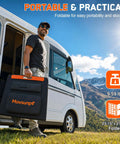 Man holding Portable Solar Panel 100W Foldable ETFE Charger with high efficiency, near RV, mountains in background.