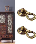 Top Notch Vintage Brass Drop Ring Pulls Slick Antique Finish Hand Painted Red For Kitchen Cabinet Drawer Furniture Hardware close-up.