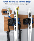 Wall Mounted Ski And Snowboard Rack, Space Saving Garage Organizer, skis secured with heavy duty holders on wooden wall.
