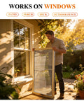 Person holding Two Pack Window And Door Screen Replacement Kit With 48 Inch By 99 Inch Screens Includes Retainer Spline And Press Fit Roller Tool 65.6 Feet Total Scratch Proof Polyester Mesh For Patio And Pet Friendly Grey outdoors by window.
