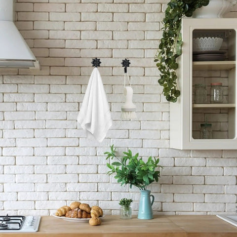 Heavy Duty Retro Flower Wall Hooks Eight Pack Slick Vintage Decorative Hardware Holds Up A Ton, displaying towels and a brush in a kitchen setting.