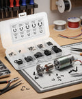 120pc Black Beryllium Bronze E Clip Retaining Ring Set For M1.5 To M10 Open Design Ideal For Pro Shops And Workshops Corrosion Protection Helps Prevent Loosening Washer Clip Snap Ring Kit. black E clips in organizer on workbench for motor shaft assembly
