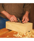Precision Miniature Smoothing Bench Hand Plane With High Carbon Steel Blade And Ductile Iron Body used for fine woodworking on wood block.