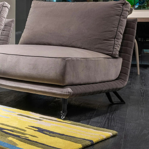 Adjustable Sofa And Bed Leg Set With Caster Wheels, Cold Rolled Steel, supporting corner of gray couch on hardwood floor
