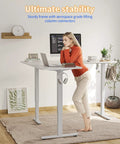 Kickstart Your Home Office Upgrades With Killer Electric L Shaped Standing Desk 63 By 55 Inches Height Adjustable Corner Workstation Reversible Setup White Finish Smooth Motor Operation Ultimate Workspace Boost, woman using desk.