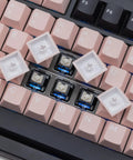 Compact Wireless Mechanical Keyboard With Tri Mode Connectivity And A Slick Dot Matrix Screen Plus Custom Volume Knob For Hella Smooth Typing Vibes And Epic Gaming Sessions Powered By Massive 10000Mah Battery showing pink keys and white keycaps.