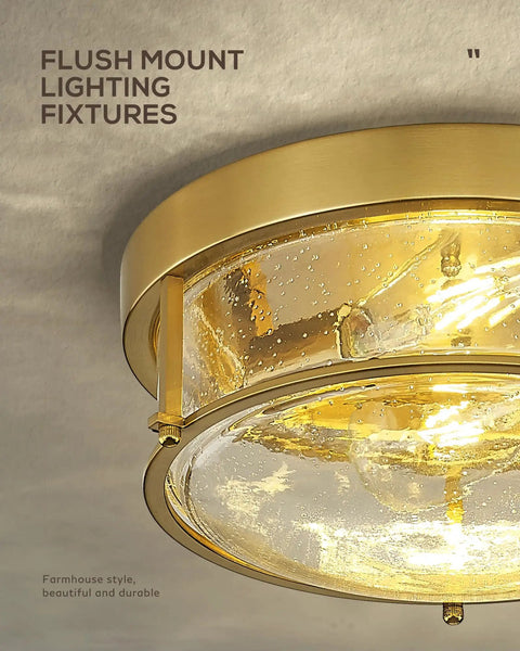 Close-up of 12 Inch Flush Mount Ceiling Light Fixture With Two Lights, Brass Gold Finish And Seeded Glass on ceiling