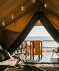 Indoor 2 Pack G50 LED String Lights With Vintage Filament Bulbs, 24 Feet Each, in a cozy tent setting by the beach
