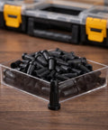 Fifty Pack Black Nylon Caster Stem Socket Sleeve With Secure Grip Neck For Office Chair Leg Swap Bushing and clear storage container.