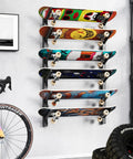 Get Your Shred Stacks Right With This Rad 6 Tier Skateboard Wall Mount Rack Cuts The Clutter By Keeping Boards Off The Floor Holds Up To Six Decks With Secure Install, displaying six vibrant skateboards.