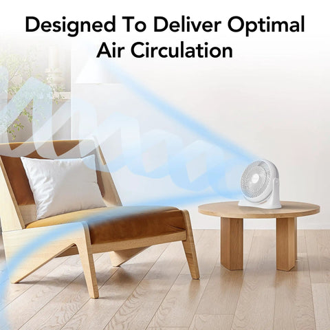 11 Inch Desk Fan With Three Speed Settings Dead Quiet Personal Air Circulator Bringing No Fuss Ninety Degree Tilt Adjustable Handle And Cool Breeze For Bedroom Office Or Sleeping Area White on table beside a chair.