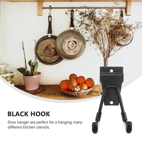 Rock Solid Black Metal Wall Hooks For Bags And Hats With Heavy Duty Mount That Keeps Your Space Looking Crisp And Organized Without Any Hassle For Hanging Coats And Towels In The Garage Or Bathroom Too, mounted black hook holding kitchen utensils.