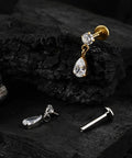 Top Shelf Titanium Cartilage Earring Flat Back Stud featuring interchangeable posts and dangle drop design on dark wood.