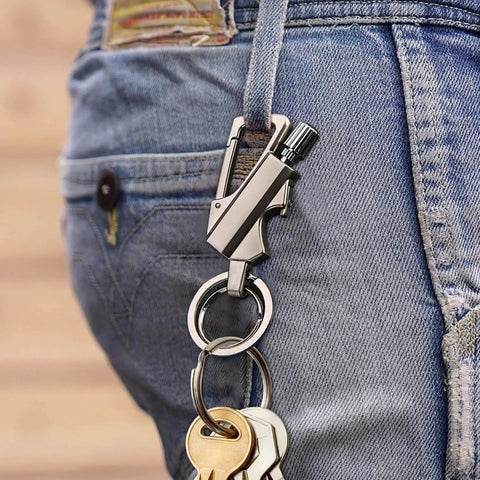 Infinity Strike Lighter With Multitool Keychain And Bottle Opener Plus Reusable Flint Fire Starter hanging from jeans belt loop