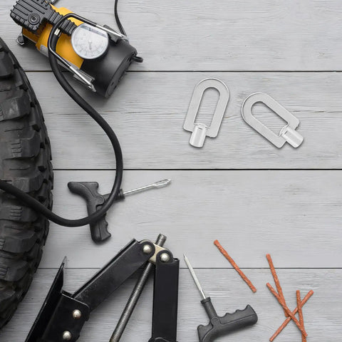 3 Piece Auto Dent Puller Kit with aluminum ring tools on a wooden surface, shown with a tire and repair accessories