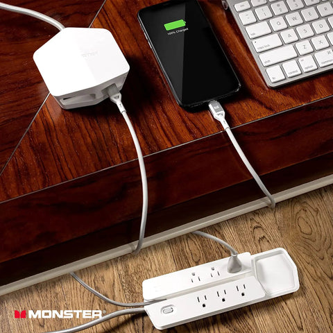 Vertex Six Outlet Power Center Surge Protector With Four Foot Detachable Magnetic Mount And USB Hub Two USB A And One USB C For Computers TVs Audio Gear White shown on desk with phone charging