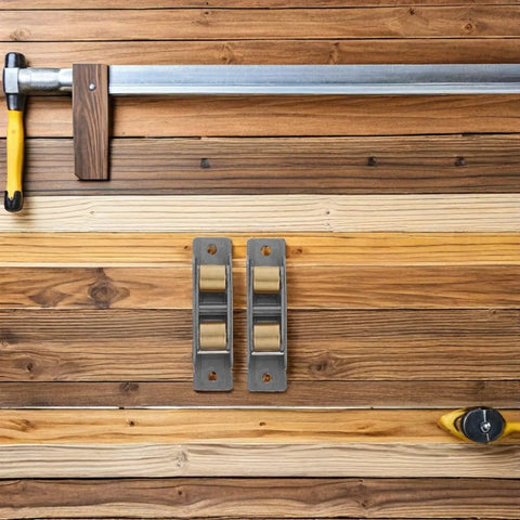 Upgrade Your Sliding Door Game Today With These Heavy Duty Stainless Steel Double Wheel Track Rollers on wooden backdrop.