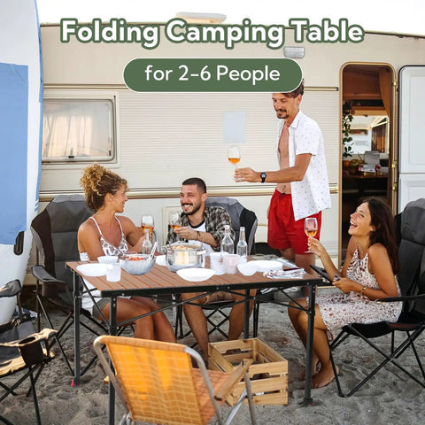 Tailgate Ready Portable Outdoor Adjustable Height Camping Table For 2 To 6 People at a campsite with friends dining