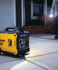 3500 Watt Portable Inverter Generator With Quiet Technology And CO Shield for home use, shown on driveway with wheels visible.