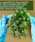 Hands in blue gloves holding plants over Heavy Duty Biodegradable Paper Weed Barrier Roll 1.31x50 Ft For Lawn And Garden