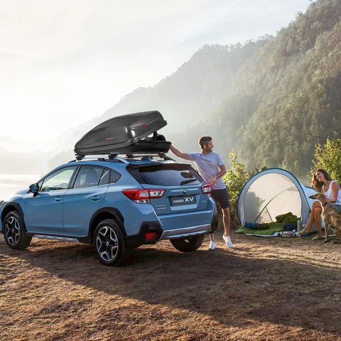 Rock Solid Rooftop Cargo Carrier Hard Shell Waterproof Gear Box Featuring Dual Side Opening on Subaru XV at campsite.