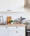 Ten Pack One And One Quarter Inch Matte Black Round Cabinet Knobs Zinc Solid Drawer Pulls For Cabinets Cupboards Dresser Closet And Bathroom Modern Hardware For Kitchen And Furniture Durable Rust Resistant installed on white kitchen cabinets