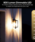 Bulb Cam 2K HD Smart Security Light With Color Night Vision, 800 Lumen Dimmable LED installed outdoors on a wall at night