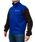 Person wearing DVALIN Hybrid FR Leather Welding Jacket With Leather Sleeves And Snap Buttons for protection during welding.